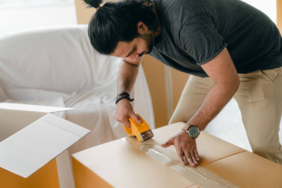 Packing a carton with tape